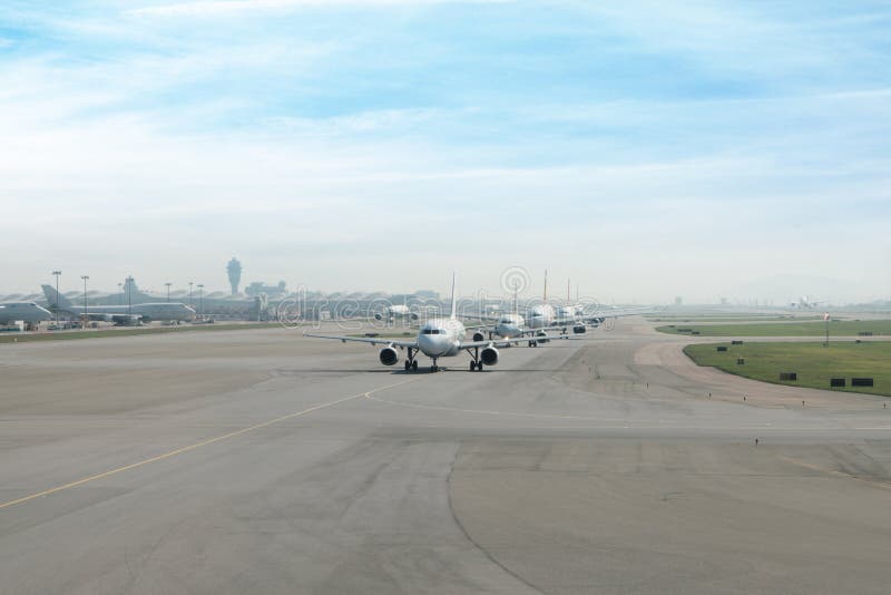 Many airplane prepare takes off from the runway in airport.