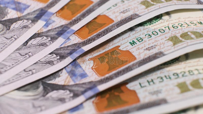 American Banknotes of 100 Dollars on Rotating Table. Closeup stock footage