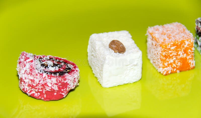 Many Assorted Multicolored Turkish Delight Green Background Stock Photo