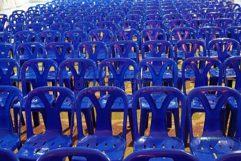 Many Blue Plastic Chairs at a Restaurant in a School.Chairs with Nobody