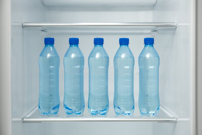 Fresh And Chilled Bottles Of Drinking Water In The Fridge Stock Photo,  Picture and Royalty Free Image. Image 84643878.