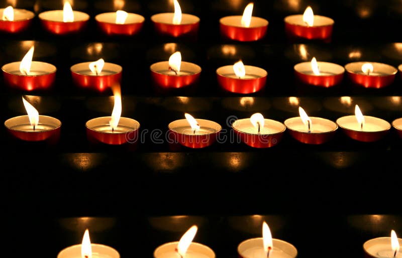 Many Candles Lit Inside the Place of Worship To Pray Stock Image