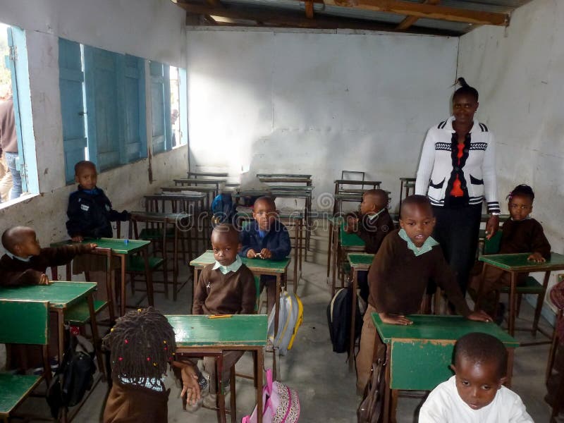 Many Children of African Ethnic Origin Sit at Desks and Study in the School Environment