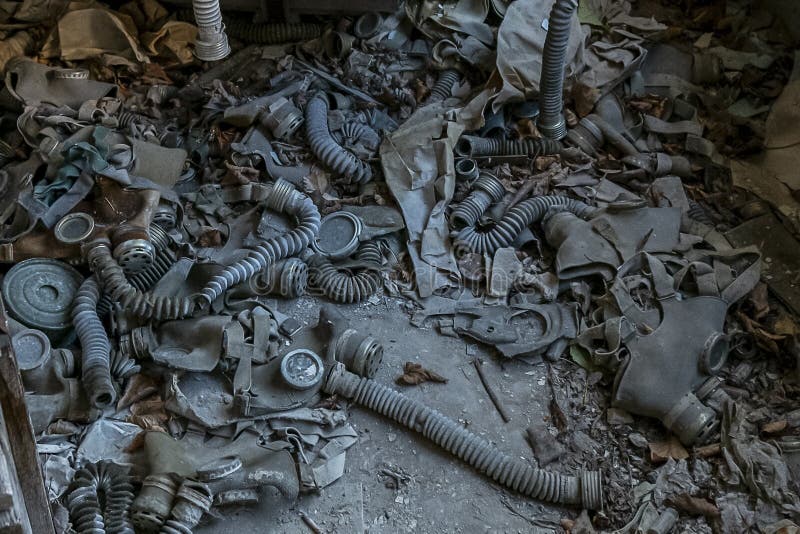 Many children`s gas masks are spreading in the classroom of abandoned school