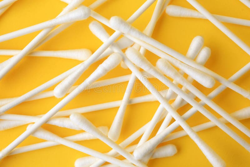 Many Clean Cotton Buds on Yellow Background, Flat Lay Stock Image