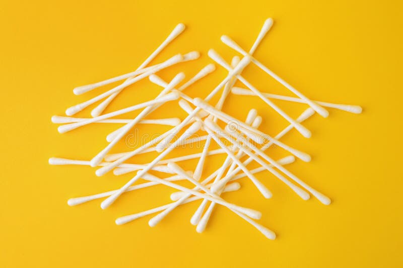 Many Clean Cotton Buds on Yellow Background, Flat Lay Stock Image
