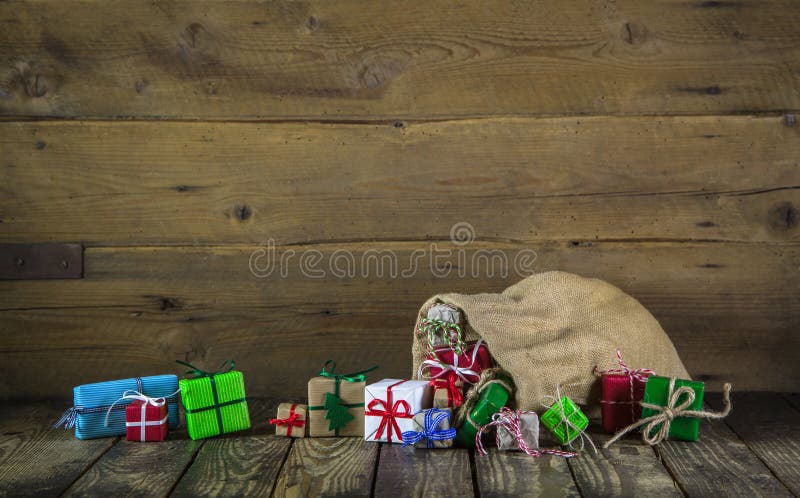 Many colorful christmas presents on wooden old background. stock photos Many colorful christmas presents on wooden old background. stock photos