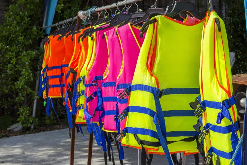 Many Colorful Life Jacket or Life Vest Hanging on a Clothesline Stock ...