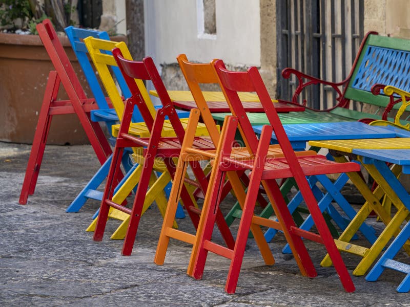 Many colors wooden chairs stock image. Image of green 224225285