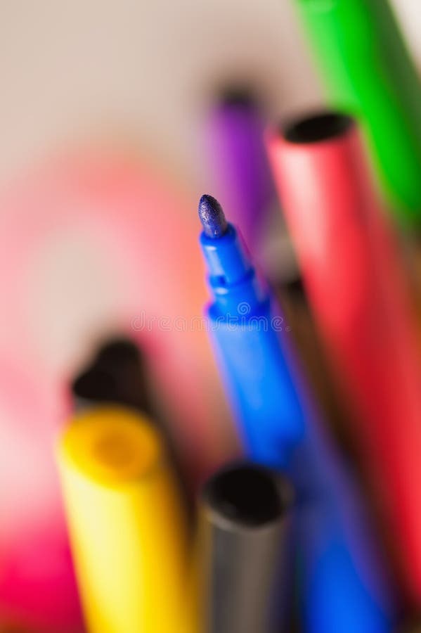 Many coloured felt tip standing in a box royalty free stock image