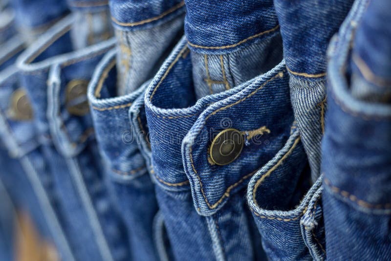 Many Denim Jeans Hanging on a Rack Stock Image Image of denim, male
