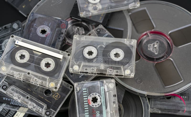 Many different audio cassettes and audio tapes on reels stock image Many different audio cassettes and audio tapes on reels stock image