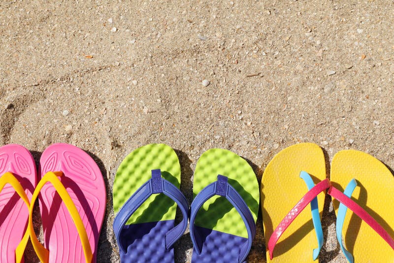 Many Different Flip Flops on Sand, Flat Lay. Space for Text Stock Photo ...