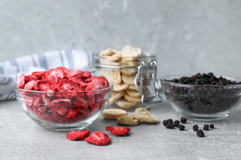 Many different freeze dried fruits on light grey table