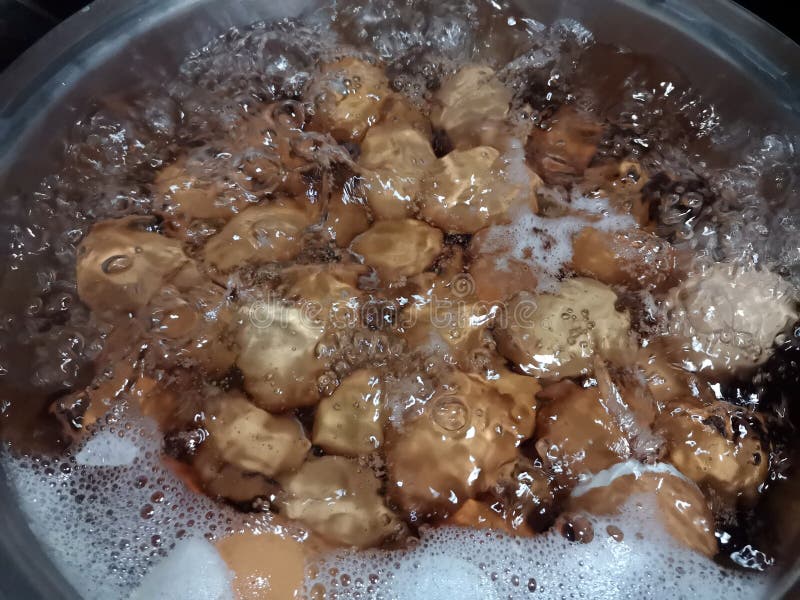 Many eggs boiling in a pot of water. eazy cooking stock photos Many eggs boiling in a pot of water. eazy cooking stock photos