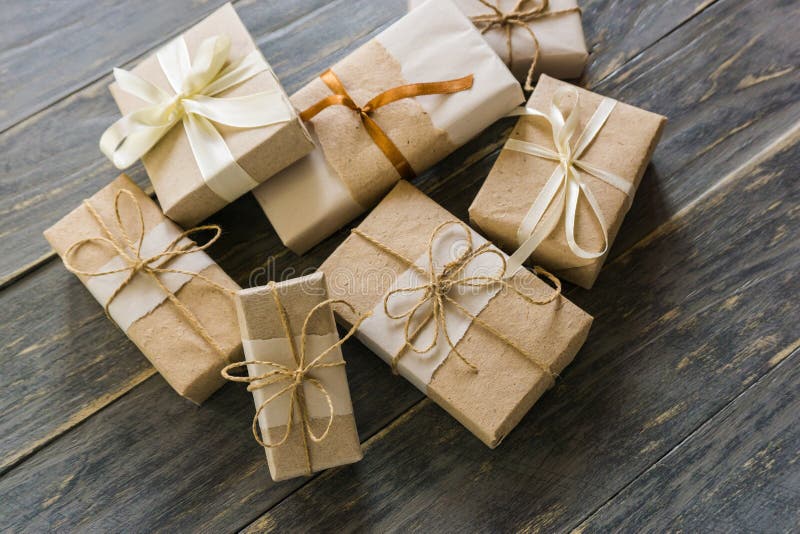 Many gifts wrapped in wrapping paper. Rustic, rural.