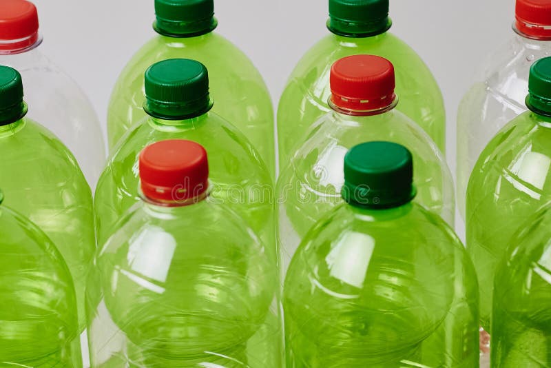 Many Green Plastic Bottles with Caps Stock Photo - Image of empty