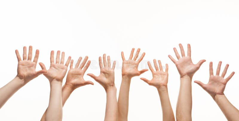 Many hands reaching out in the air stock photo