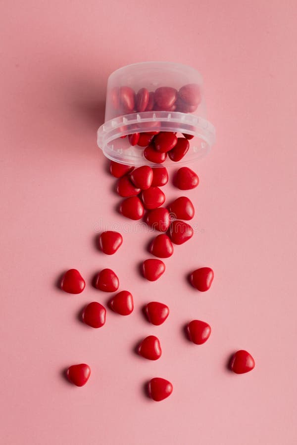 Many hearts scattered on the pink table stock photos Many hearts scattered on the pink table stock photos