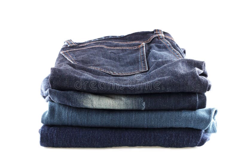 Many Jeans Hanging on a Rack. Row of Pants Denim Jeans Hanging in