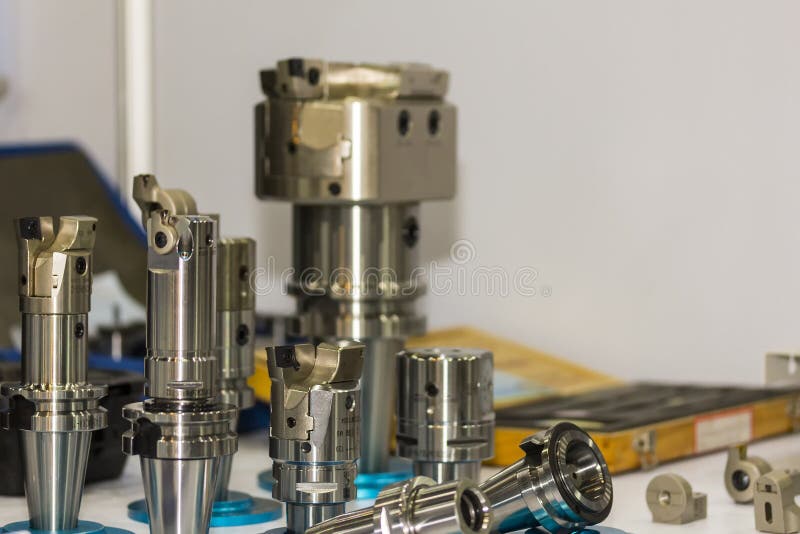 Many kind of high precision cutting tool carbide tip cutter set up in holder for cnc milling or machining center stock image Many kind of high precision cutting tool carbide tip cutter set up in holder for cnc milling or machining center stock image