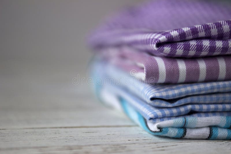 Many kinds of cotton fabrics in stripes and cage on a lilac backMany kinds of cotton fabrics in stripes and cage on a lilac backgr