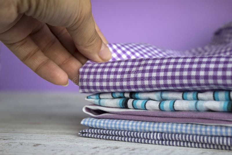 Many kinds of cotton fabrics in stripes and cage on a lilac backMany kinds of cotton fabrics in stripes and cage on a lilac backgr