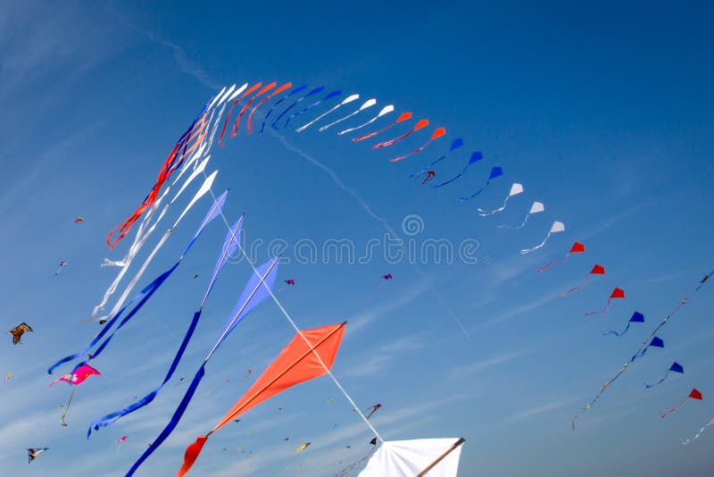 Many kites flying. In the blue sky royalty free stock photos