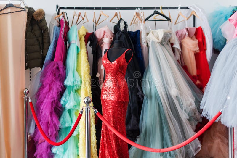 Many Ladies Evening Gown Long Dresses On Hanger In The Dress Rent Shop many-ladies-evening-gown-long-dresses-on-hanger-in-the-dress-rent-shop