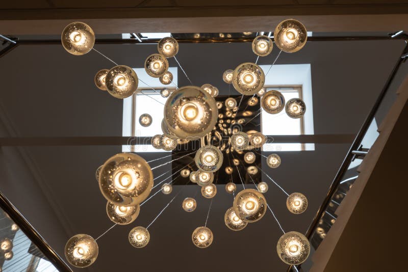 Many Light Bulbs that Go Down with Their Cables from the Ceiling