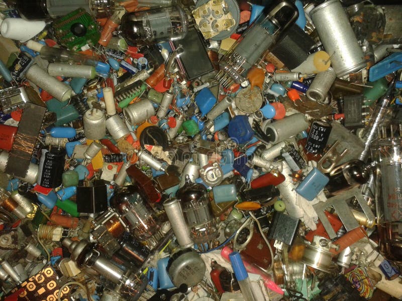 Many radio components resistors, lamps, coils, diodes, capacitors, transistors, coils, wires royalty free stock photography Many radio components resistors, lamps, coils, diodes, capacitors, transistors, coils, wires royalty free stock photography