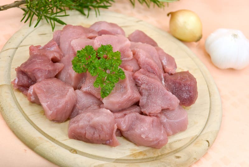 Many raw pork slices - cubes