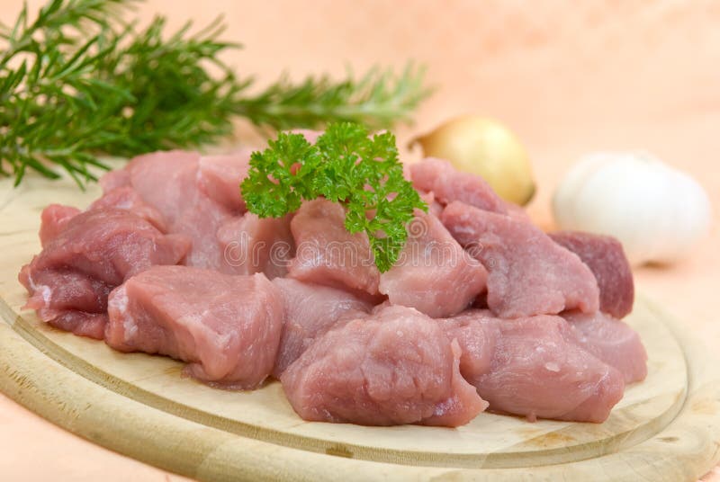 Many raw pork slices - cubes