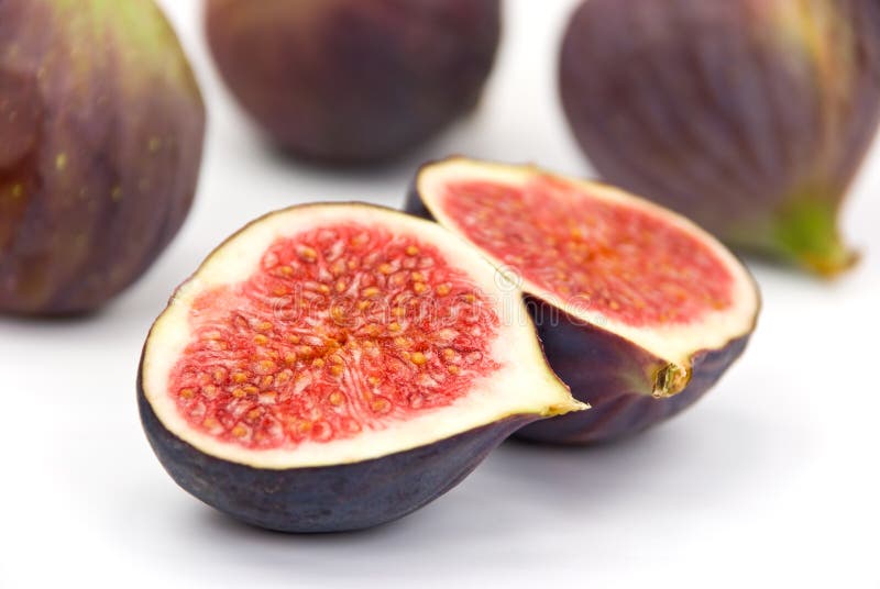 Many ripe,freshly figs on the white background