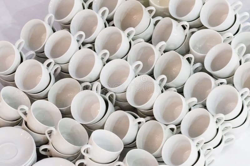 Many rows of white ceramic coffee or tea cups stock photography Many rows of white ceramic coffee or tea cups stock photography