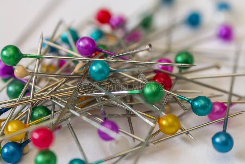 The Many Sewing Push Pins On The White Background Stock Photo Image