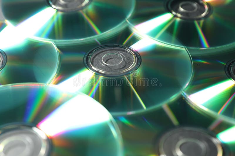 Many shiny compact discs as background, closeup stock photo