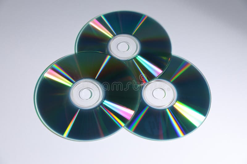 Many shiny compact discs on light background stock photos