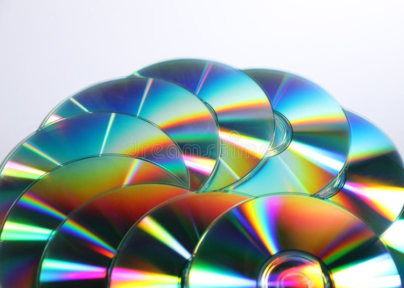 Many shiny compact discs on light background royalty free stock photo