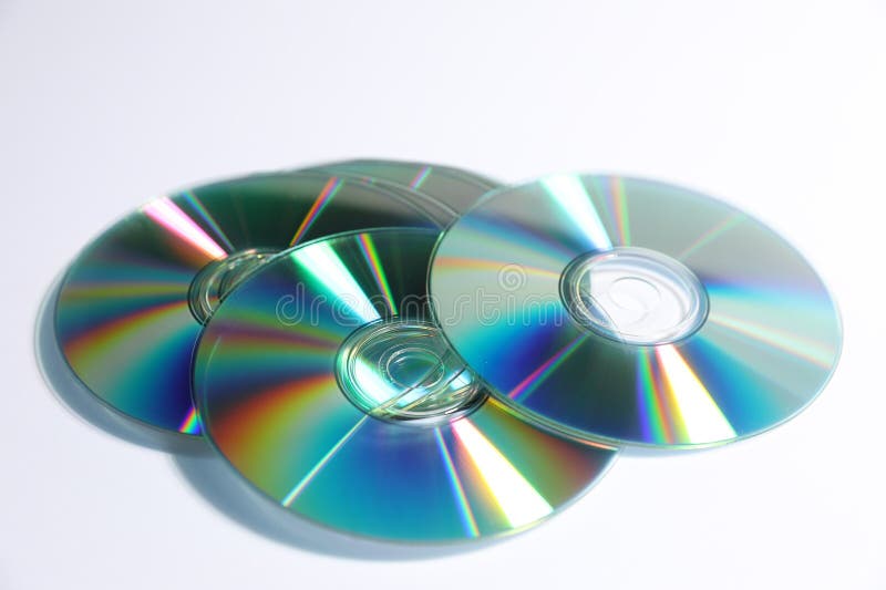 Many shiny compact discs on light background royalty free stock images