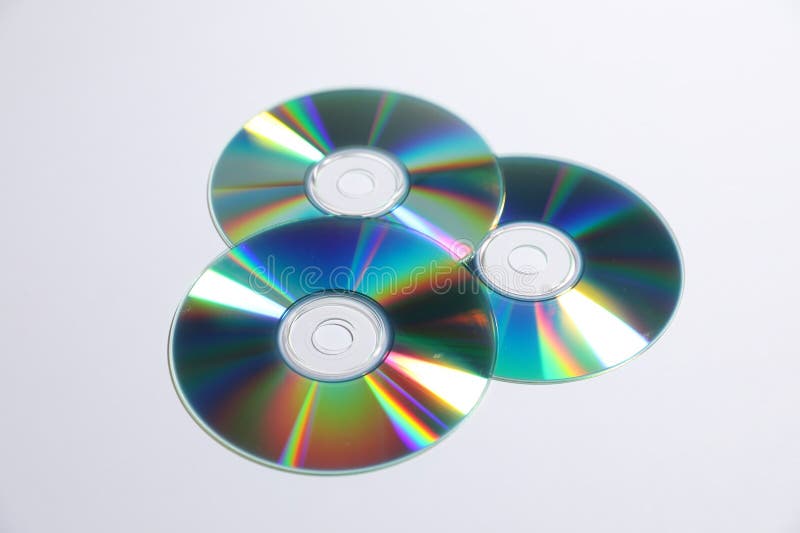 Many shiny compact discs on light background stock image
