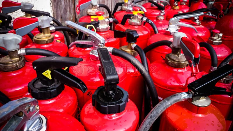 Many used fire extinguishers, top view royalty free stock photography