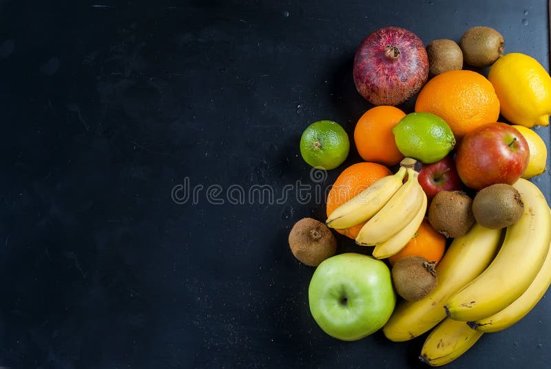 Many various fruits on a black background