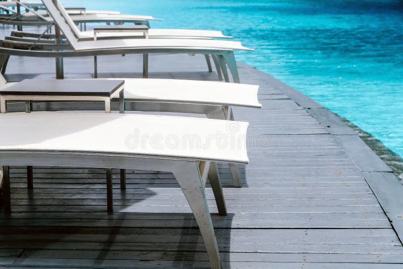 Many White Chaise Lounge by the Pool Stock Photo Image of material