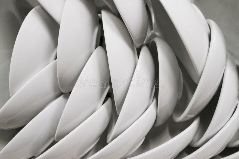 Many of white plate and bowl on shelves in kitchenware shop. Abs stock photo
