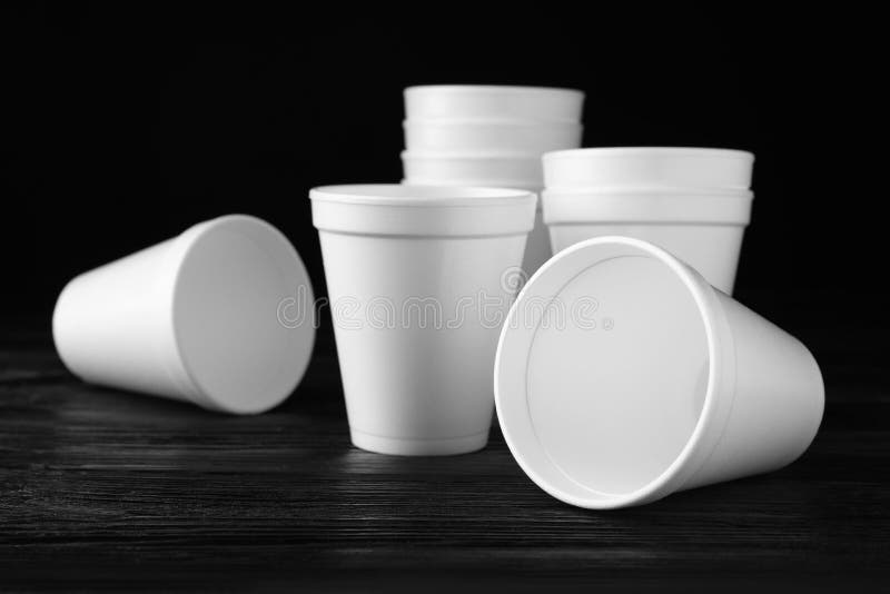 Many White Styrofoam Cups on Black Wooden Table, Closeup Stock Image