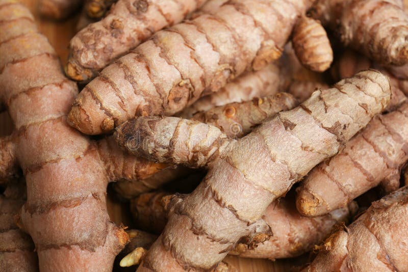 Many Whole Turmeric Roots As Background, Closeup Stock Photo Image of
