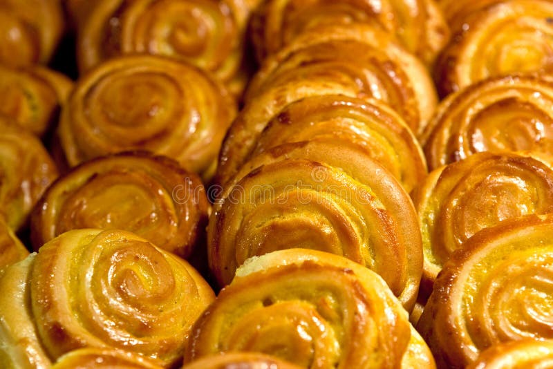 Many yellow cakes in cafe in morning