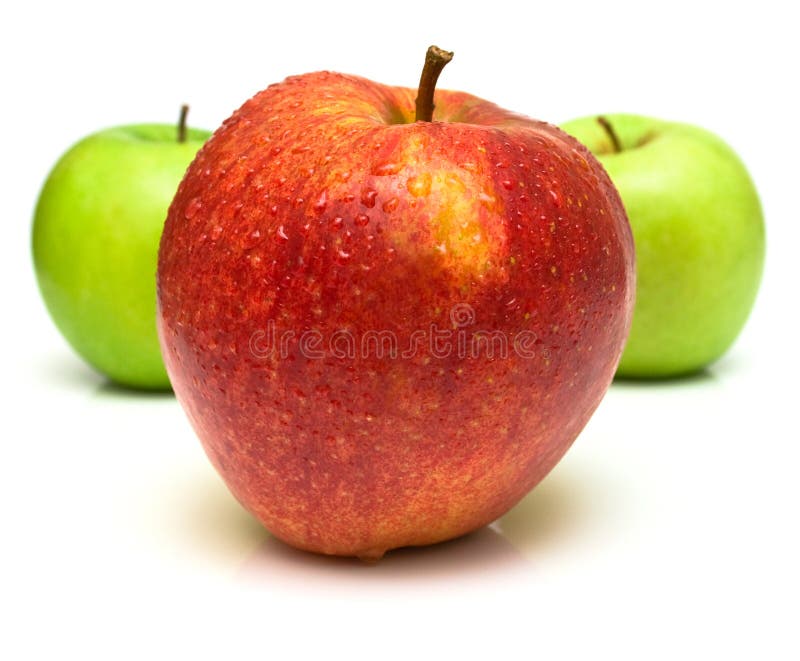 Red and green apples with water drops on the white background. Isolated. Shallow DOF. Red and green apples with water drops on the white background. Isolated. Shallow DOF.