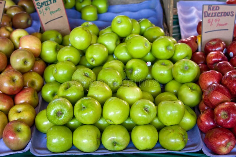 Three (3) kinds of apples, Granny Smith, Red delicious, stacked at a fresh farmers market. Three (3) kinds of apples, Granny Smith, Red delicious, stacked at a fresh farmers market